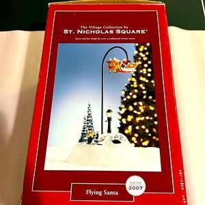 Christmas village.  Flying Santa